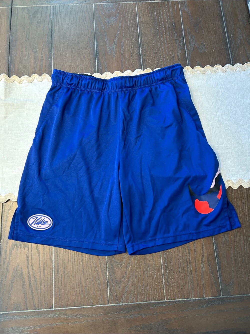 Nike Blue Dri-FIT Athletic Shorts with Black Waistband and Pink Logo
